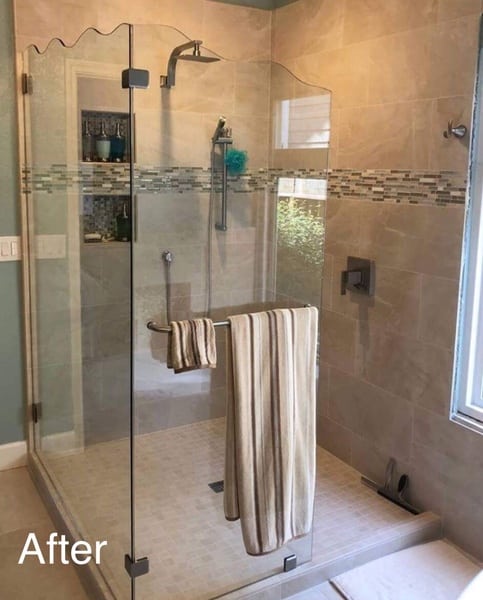Master shower after remodel with custom tile installation and glass enclosure