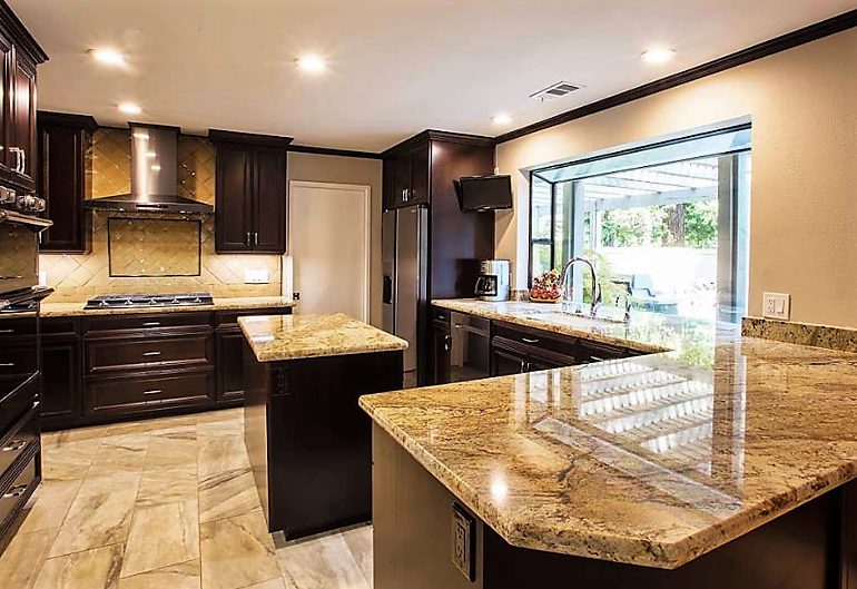 An Elegant Kitchen after remodel with Typhoon Bordeaux granite countertops