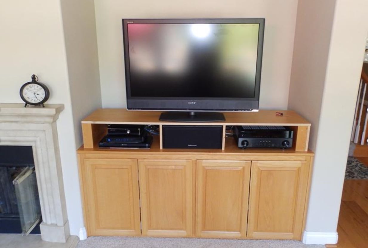 entertainment wall before with blond oak