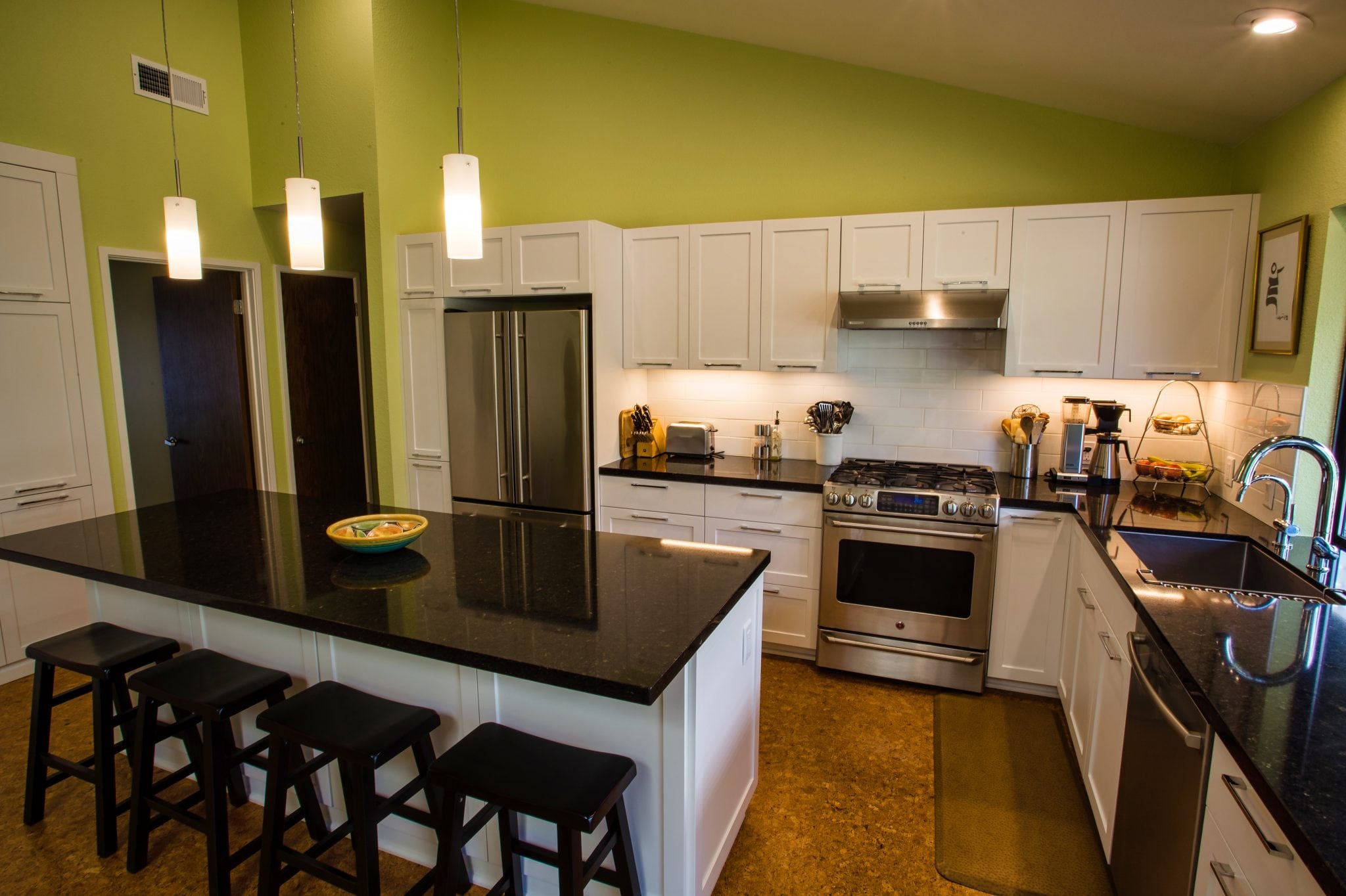 Black countertops and white cabinets