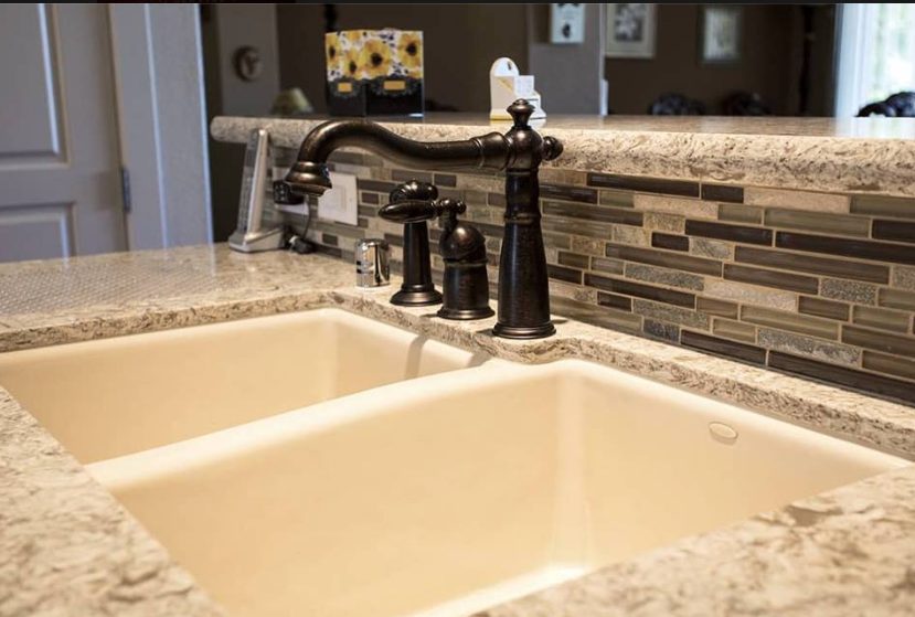 Cambria counter top and linear glass tile back splash - Leslie Kate photo