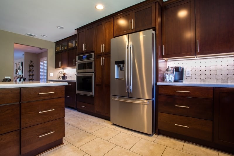 Kitchen with large stainless refrigerator
