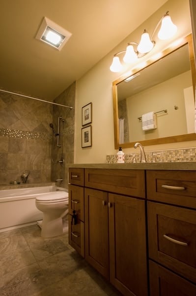 Bathroom with cabinets in ginger finish and Lyndale door style