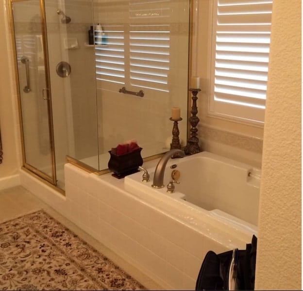 white tub and shower before remodel