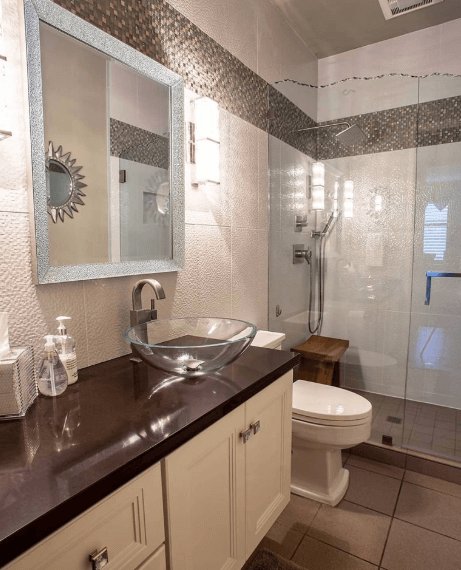 contemporary bathroom with custom tile and glass shower enclosure